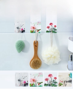 Detail of transparent adhesive wall hook featuring elegant lotus pattern and sturdy steel hook
