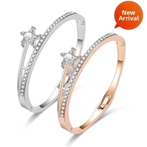 Detail view of star-shaped zircon bracelets with micro-paved rhinestones in dual-tone