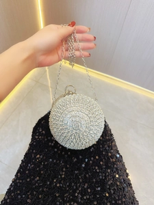 Sparkly silver spherical evening bag with rhinestones and metal handle for parties