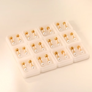 Minimalist pearl stud earrings set with 12 pairs of elegant white pearls and gold screw backs
