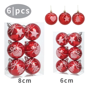 Detail view of red Christmas ornaments in 6cm and 8cm sizes with star and heart patterns