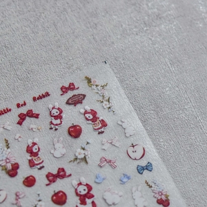 Japanese style nail art stickers featuring cute red rabbits, apples and floral patterns