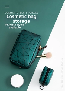Detail of dark green geometric PU leather makeup bag set with a mini square coin pouch