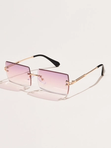 Detail view of rimless square sunglasses with gradient pink lenses and gold metal frames