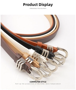 Close-up of five thin belts in neutral colors with silver oval metal buckles