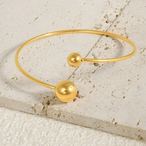 Minimalist 18k gold plated stainless steel cuff bangle with polished metal spheres