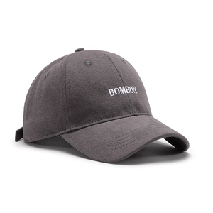 Dark charcoal cotton baseball cap with white BOMBON embroidery and curved brim