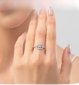 Detailed close-up of S925 sterling silver evil eye ring with blue crystal and pavé diamonds