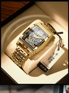 Detail of luxury gold skeleton tonneau mechanical watch in premium presentation box