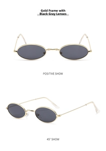 Detail view of retro small oval sunglasses with gold metal frame and dark grey lenses