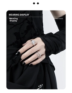 Detail of irregular textured S925 silver rings with pavé diamonds on a black glove