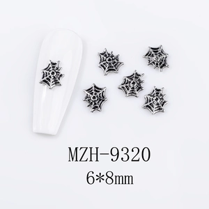 Detailed view of silver spider web nail charms with 6x8mm dimensions for DIY art