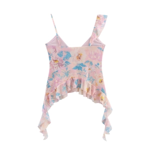 Detail of floral print top featuring asymmetrical ruffle shoulder straps and hemline