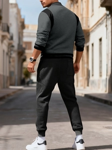 Rear view of casual dark gray tracksuit with hooded cardigan and matching joggers