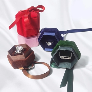 Hexagon and square velvet jewelry boxes with elegant ribbons for rings and necklaces