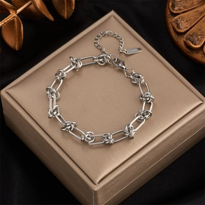 Hip hop punk style silver stainless steel knot chain bracelet on luxury black velvet display