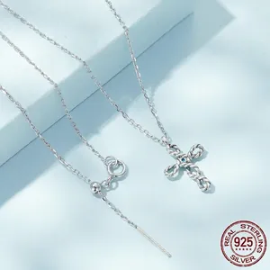 S925 silver turquoise cross pendant necklace with vintage braided texture on blue stand