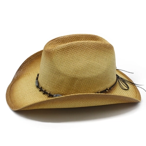 Classic straw western cowboy hat with beaded band and side feather on white background