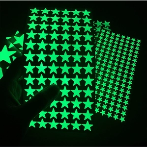 Luminous green star wall stickers glowing in the dark for creative DIY bedroom decor