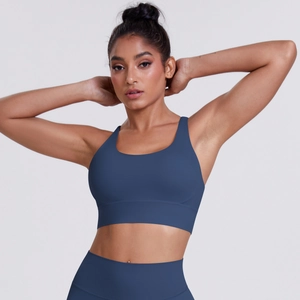 Detailed view of dark blue seamless high-waist yoga pants with matte athletic texture