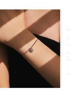 Close-up of s925 sterling silver snake chain bracelet with a single sparkling cubic zirconia