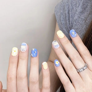 Handmade press-on nails with yellow and blue colors featuring 3D daisy flowers