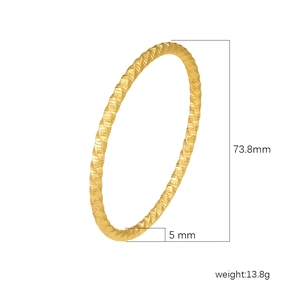 Textured gold hollow stainless steel bangle with 73.8mm diameter and faceted design