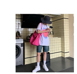 Casual lifestyle look featuring a large pink canvas tote bag with white T-shirt and denim shorts