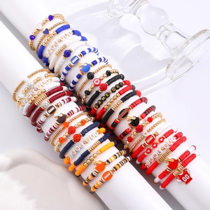 Detail of multi-layered Game Day football bracelets with clay beads and jersey charms