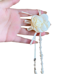 Elegant cream white fabric camellia necklace with pearls and flowing silk ribbons