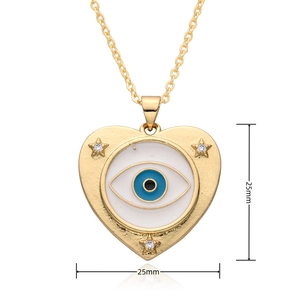 Macro shot of evil eye heart pendant in gold finish with 25mm dimensions marked