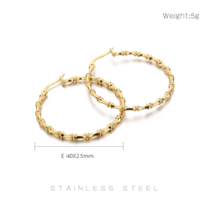 Macro view of 40mm golden bamboo textured stainless steel hoop earrings weighing 5g