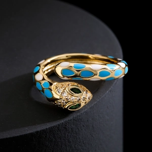 Vintage 18k gold plated snake ring with blue enamel spots and green gemstone eyes