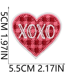 Detailed view of red plaid heart patch with XOXO embroidery and size measurements
