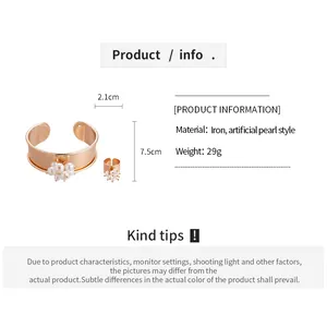 Detailed size chart for gold metal floral ring and arm cuff with pearl accents