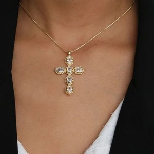 Elegant 18k gold plated necklace with cross pendant featuring six oval zircons on model