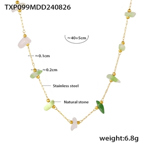 Macro detail of golden stainless steel necklace with natural stones and size details