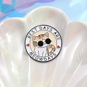 Cute cartoon cat enamel pin with black sunglasses and Best Days Are Meowdays text logo