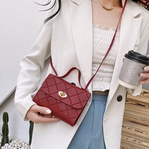 Chic red quilted faux leather crossbody bag with golden twist lock for women