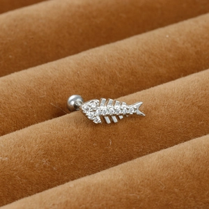 Macro shot of silver fish bone ear stud featuring sparkling micro-set white zircon stones