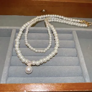 Elegant multi-layer pearl necklace with zircon pendant and golden adjustable lobster clasp
