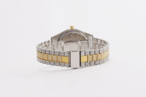 Detailed back view of a silver and gold bicolor watch strap with sparkling rhinestones