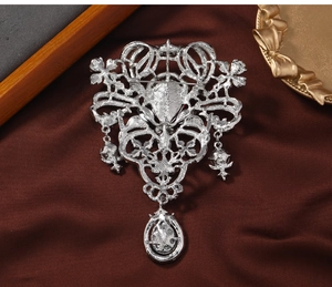 Detail view of the silver vintage brooch back structure with pin clasp and pendants
