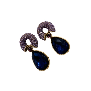 Vintage gold-plated drop earrings with blue crystal teardrops and purple horseshoe accents