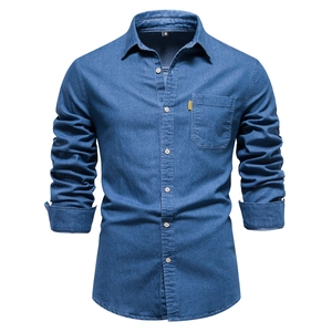 Detailed close-up of blue denim shirt collar and brand tag on a phantom mannequin