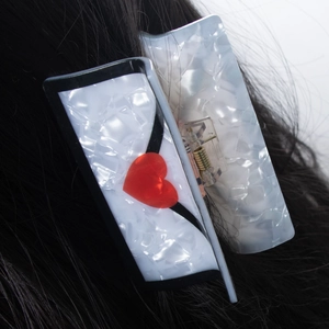 Cellulose acetate hair claw clip with black white shell pattern and red 3D heart detail