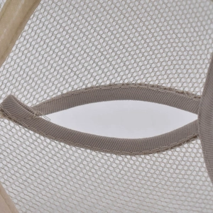 Detailed macro view of the breathable mesh back and pony tail hole on the trucker hat