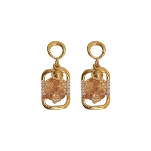 Vintage geometric gold earrings with orange crystal inlay and sparkling rhinestones