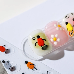 3D cartoon nail art stickers with colorful floral and character patterns on white background