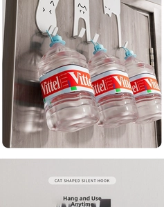Cat shaped silent hooks showing heavy duty weight capacity on door with water jugs